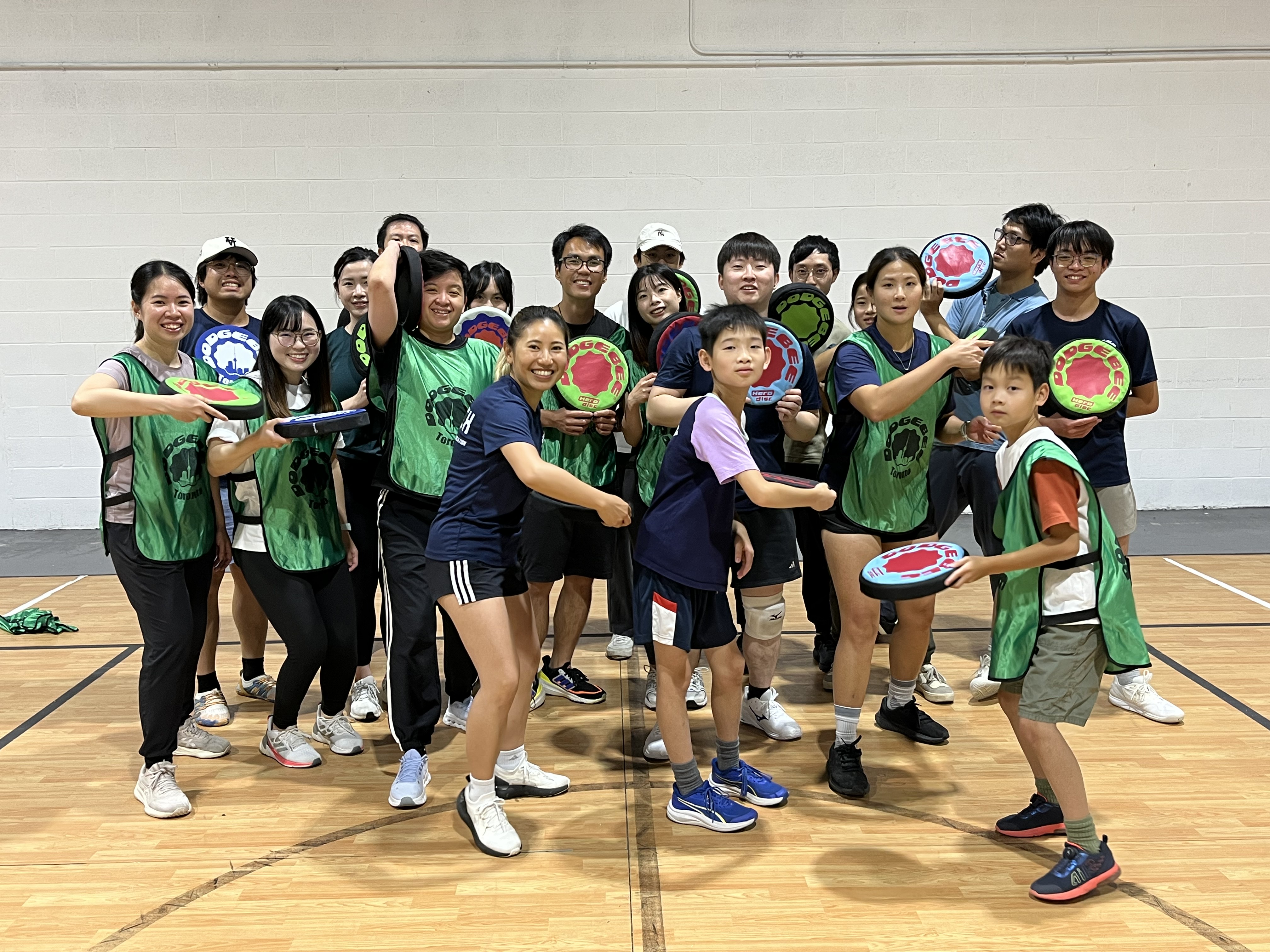 Toronto Dodgebee players gather on an indoor court holding soft flying discs.