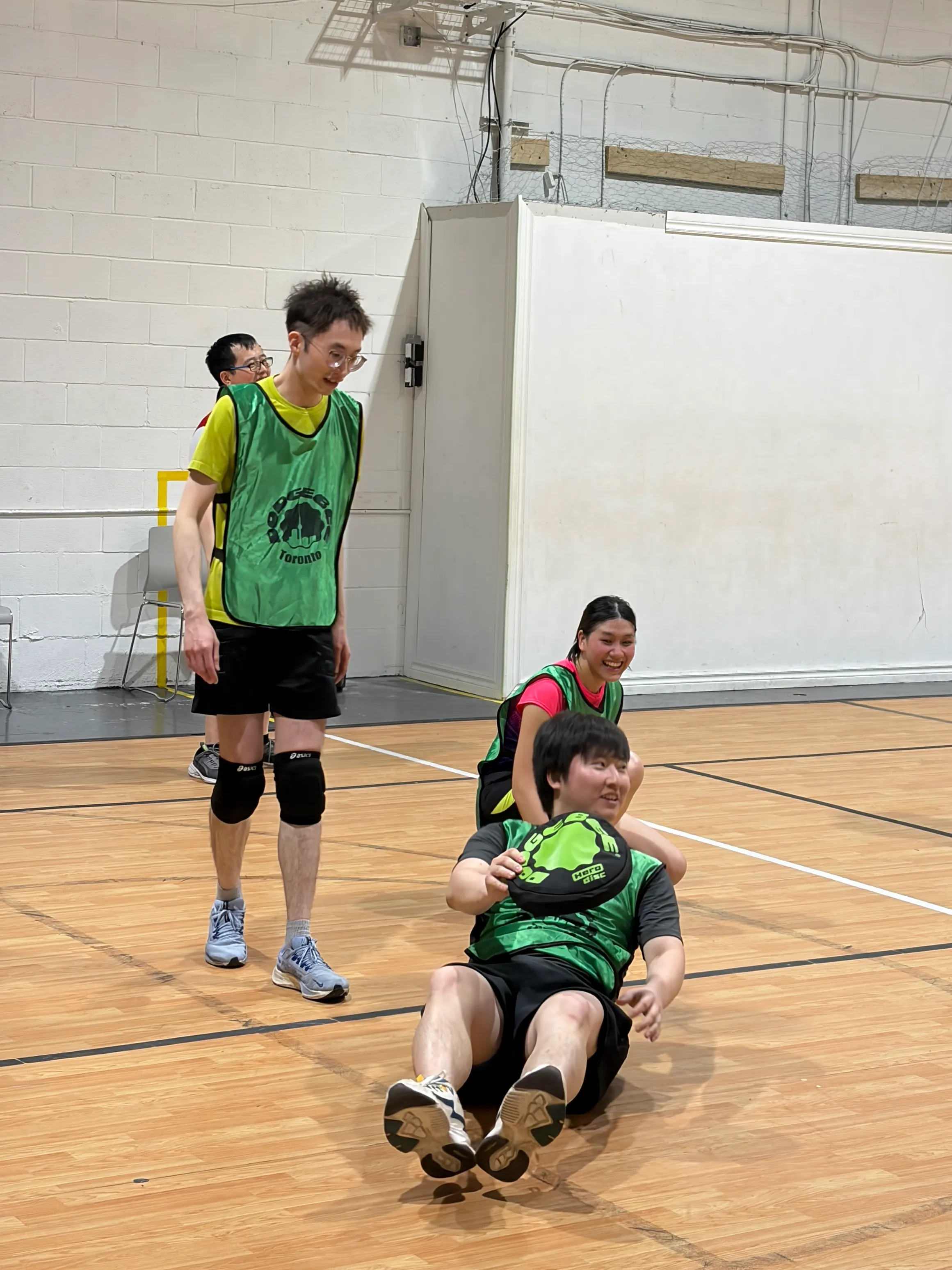 Toronto Dodgebee players laugh together during an indoor game.